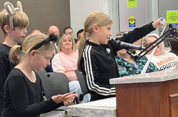 students presenting to board
