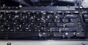 water spilling on keyboard